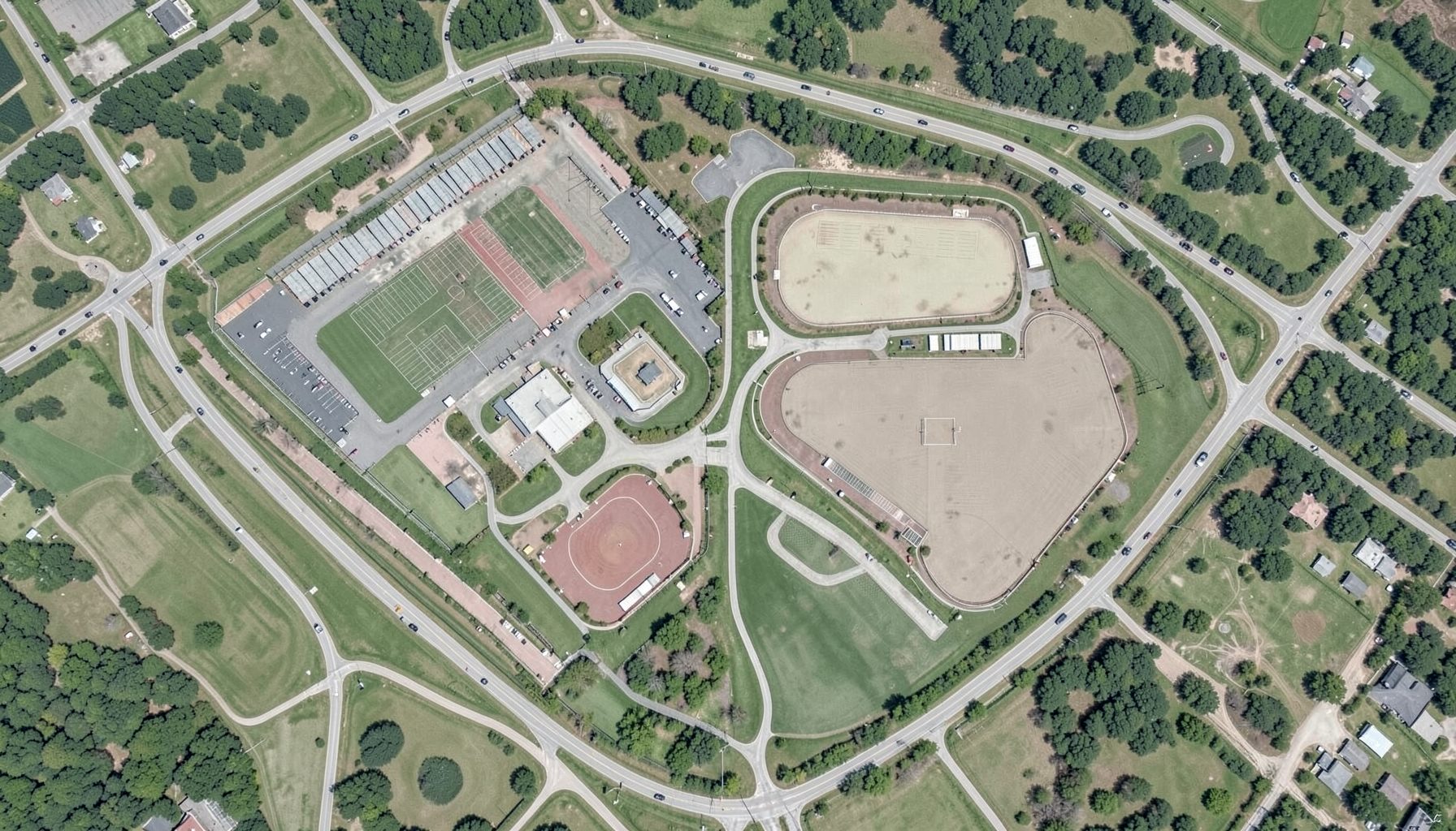 Aerial map of the Gov. James B. Hunt Jr. Horse Complex show grounds in Raleigh, North Carolina, showing arena layouts and surrounding roads on a bright day